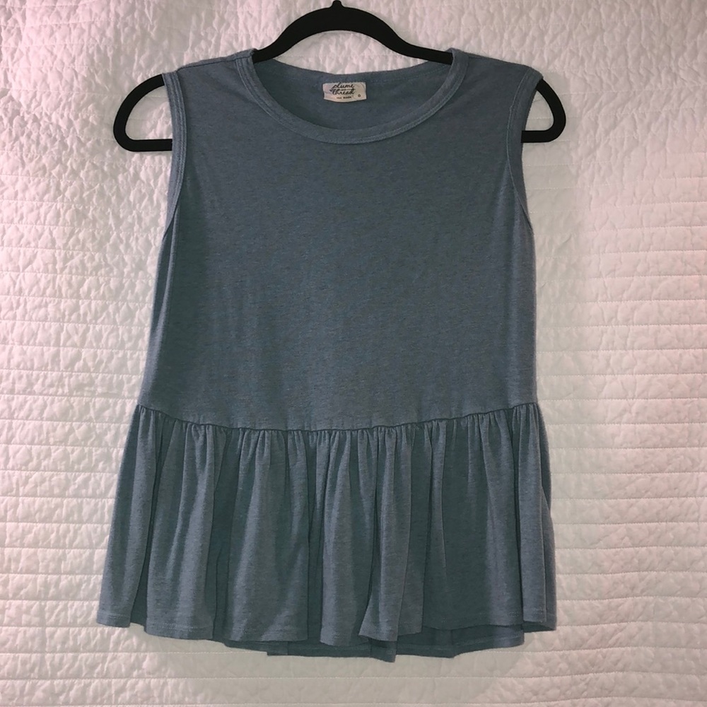 Ruffled blue sleeveless shirt
